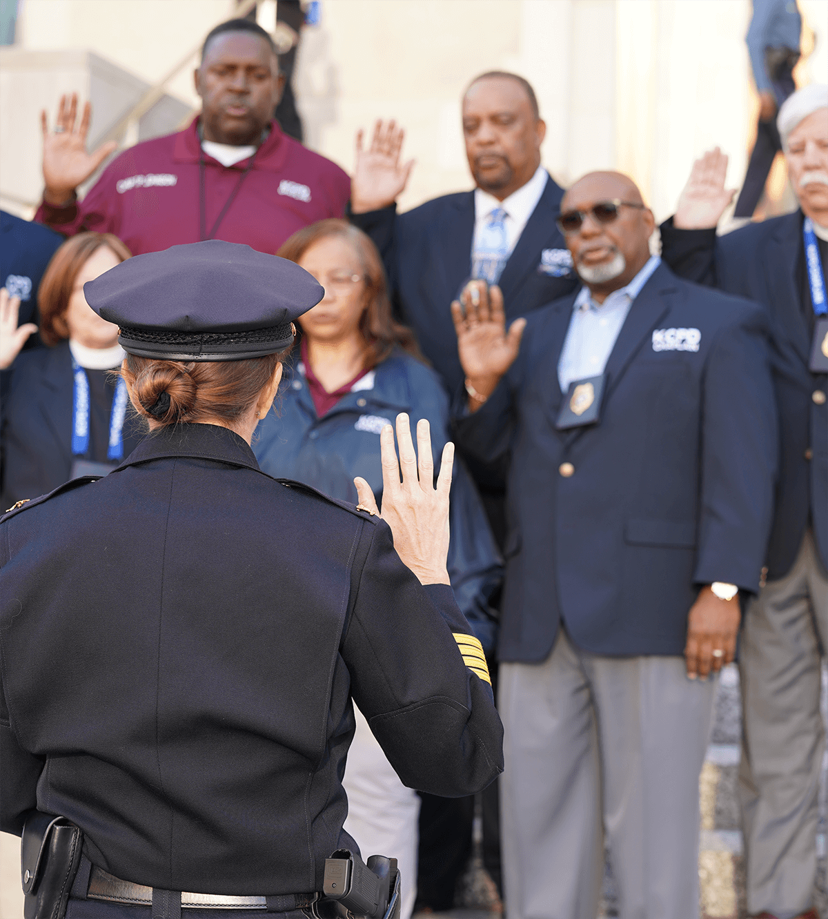 Chief Graves swearing in seven KCPD Chaplains outside the headquarters building.